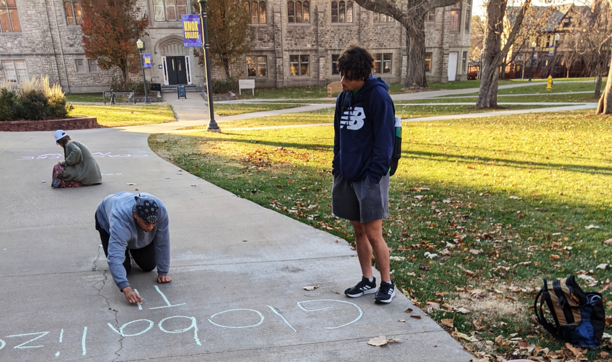 Students chalking messages for the 2023 Palestine ceasefire protest